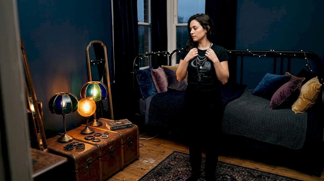 Woman choosing accessories with graphic tee